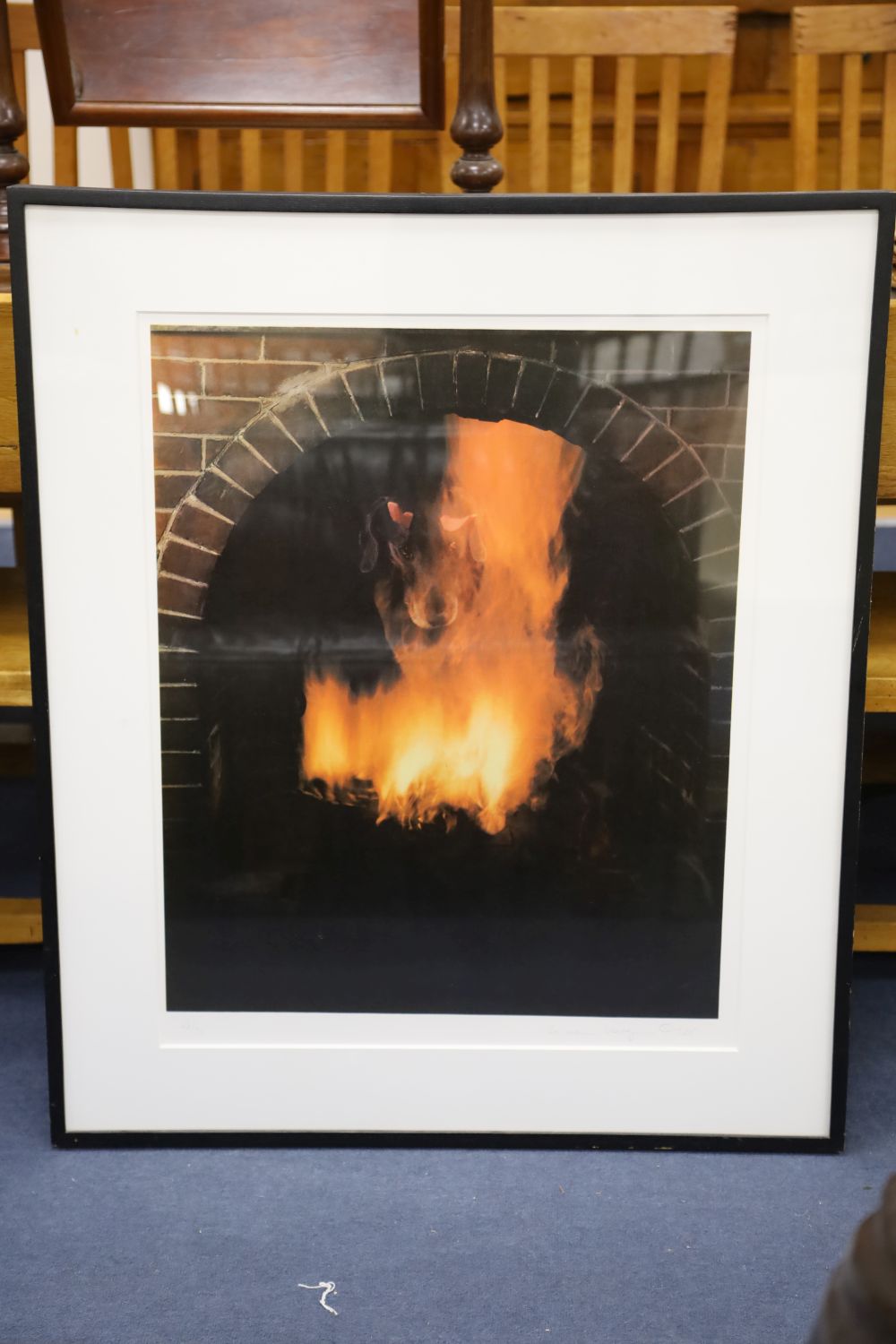 William Wegman (1943-), photographic silk screen, Dog in a fire place, signed and dated 1988, 48/96, 74 x 58cm